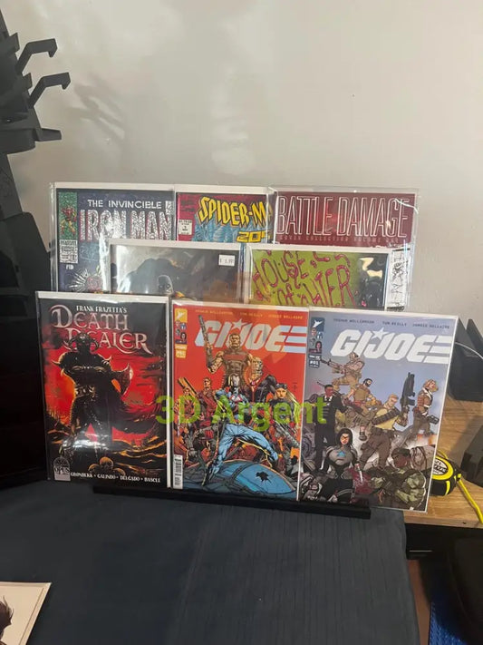 Stadium Stand – comic books displayed on black 3-tier stand