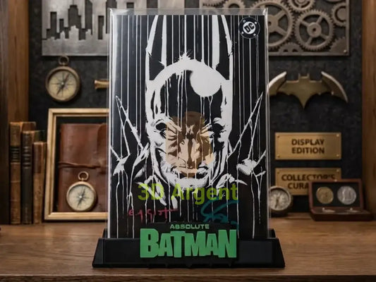 Absolute Batman comic slab display stand, black base with black and green Absolute Batman wordmark, shown with a graded comic slab