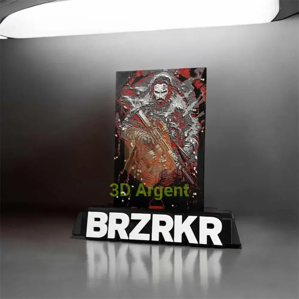 BRZRKR comic display stand shown at an angle, raised multi-colour character front plate above BRZRKR wordmark base
