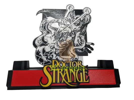 Doctor Strange comic display stand with a monochrome printed backdrop panel and gold Doctor Strange wordmark on a red base