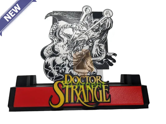 Doctor Strange comic display stand with a monochrome printed backdrop panel and gold Doctor Strange wordmark on a red base