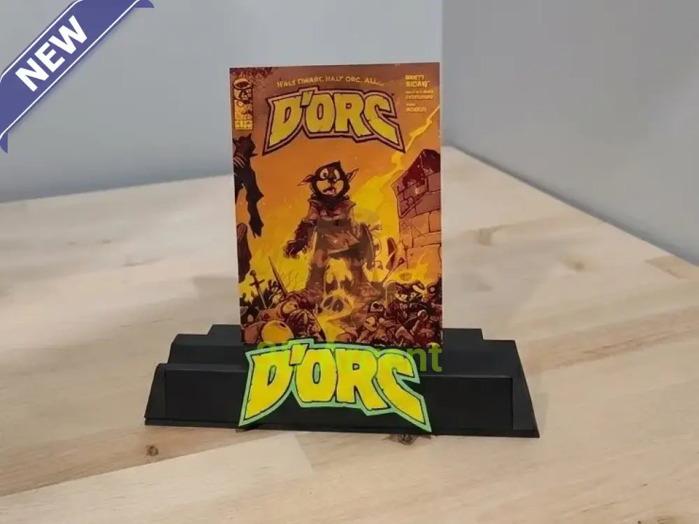 D'Orc comic display stand holding an unslabbed comic book, front logo plate visible