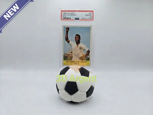 Dual-colour black and white soccer ball display stand holding a PSA graded football card