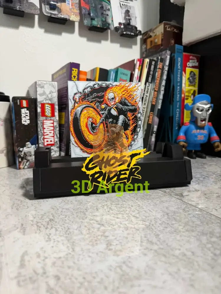 Close-up front view of the Ghost Rider comic display stand showing the multi-colour illustration and wordmark