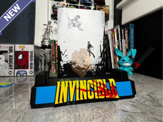 Invincible comic display stand with black and white illustrated backboard and INVINCIBLE wordmark base