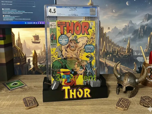Thor comic display stand, black base with red and yellow Thor wordmark, shown holding a graded comic slab (slab not included)