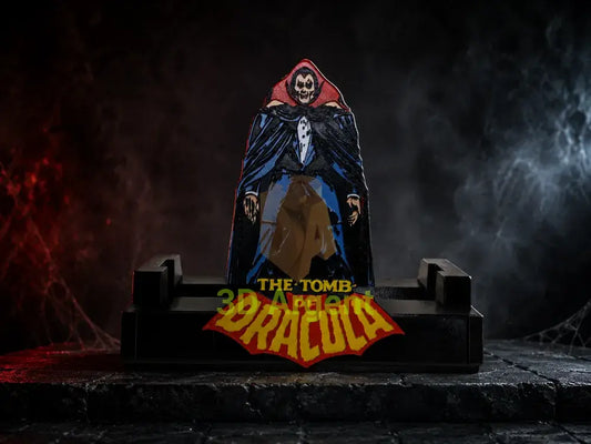 Tomb of Dracula comic display stand with printed Dracula character backdrop panel and yellow Tomb of Dracula wordmark on a red bat emblem base