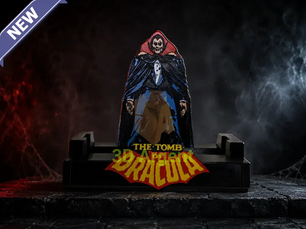 Tomb of Dracula comic display stand with printed Dracula character backdrop panel and yellow Tomb of Dracula wordmark on a red bat emblem base